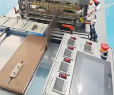 Continuous stretch shrink film packaging machine